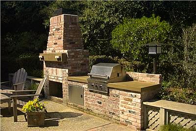 Brick outdoor kitchen with fireplace